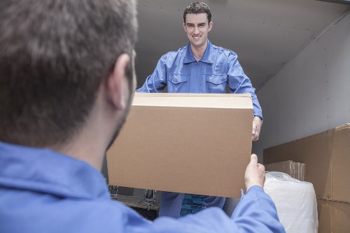 Packed boxes and furniture prepared for a South Kensington apartment relocation