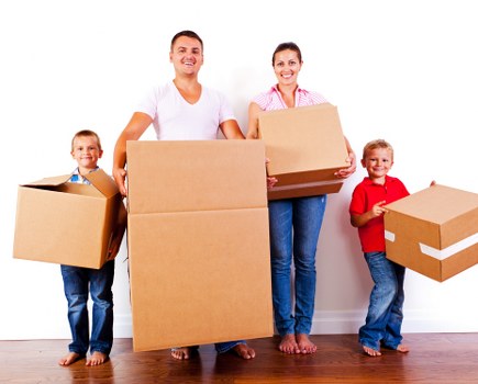 Boxes and furniture being assessed for a cubic-yard move quote