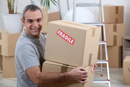 Man with van loading furniture in South Kensington street