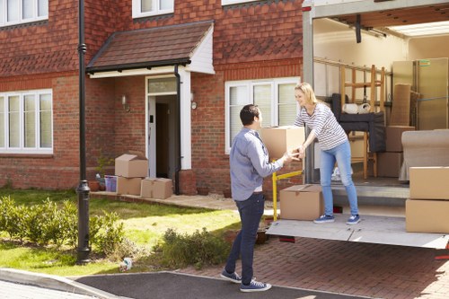 Movers loading business items for a local relocation in South Kensington