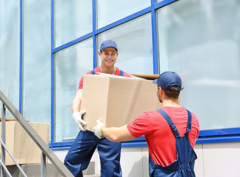 Specialist piano moving equipment used in a narrow London staircase