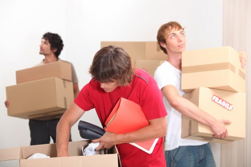 Boxes and furniture being prepared for a student move near South Kensington