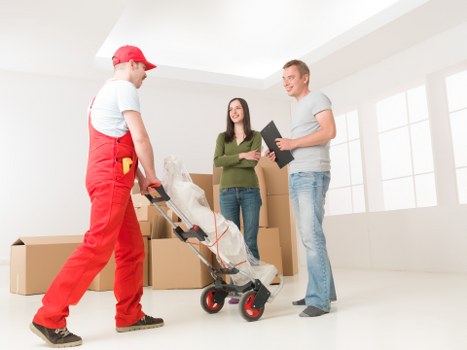 Packed moving boxes and furniture protection for a flat relocation