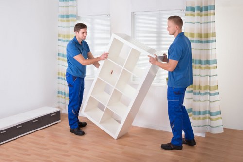 Professional moving team with safety equipment and protective gear