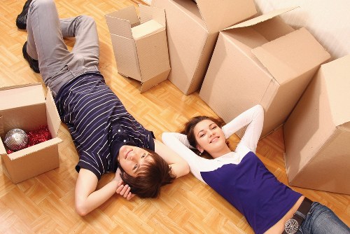 Separated cardboard, metal, and textiles prepared for recycling