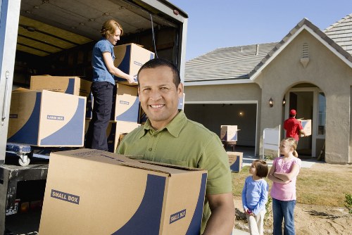 Packed boxes and furniture prepared for removals in a South Kensington flat